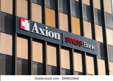 Lugano, Switzerland - 12th January 2021 : Axion Swiss Bank Sign Hanging On The Headquarters In Lugano. Axion Swiss Bank Is Specialized In High-level Private Banking And Owned By Banca Stato Group