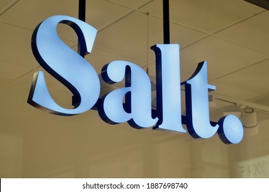 Lugano, Switzerland - 26th November 2020 : Salt Mobile Sign Hanging In Front Of A Store In Lugano. Salt. Is A Swiss Telecommunications Provider Of Mobile Telephony And Fiber-optic Land-line Services