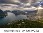 lugano, Switzerland: Aerial  sunset over the Monte Bre overlooking the city and lake of Lugano in Canton Ticino in Switzerland.