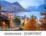 Lugano, Switzerland cityscape with Monte Bre on Lake Lugano at night.