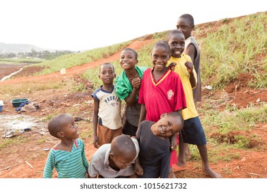 Lugazi, Uganda. 13 June 2017. A Bunch Of Ugandan Children Laughing, Smiling, Waving Or Making Funny, Wacky Faces And Contortions.