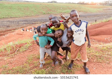 Lugazi, Uganda. 13 June 2017. A Bunch Of Ugandan Children Laughing, Smiling, Waving Or Making Funny, Wacky Faces And Contortions.