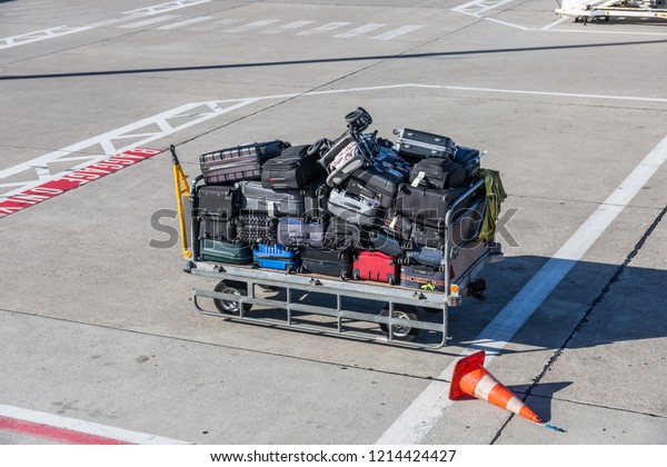 Luggage cart full\
with baggage at the airport\

