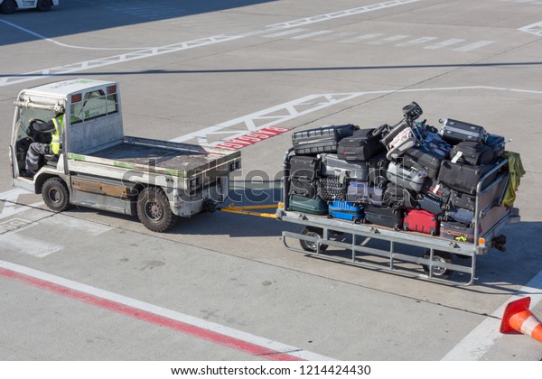 Luggage cart full\
with baggage at the airport\
