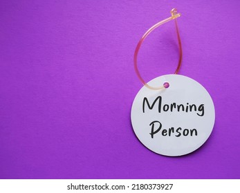 Luggage Tag On Red Background With Handwritten Text MORNING PERSON, To Improve Overall Wellness, Enhances Productivity,decrease Stress Level From Being Rush To Work