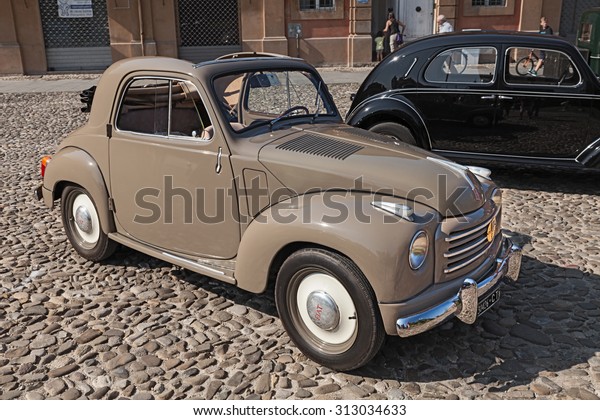 LUGO, RA, ITALY - AUGUST 30: old italian small\
car Fiat 500 C Topolino Trasformabile (1954) parked during the\
classic car, motorcycle and bicycle rally, on August 30, 2015 in\
Lugo, Ravenna, Italy\
\
