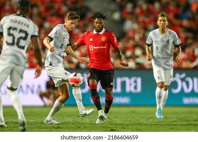 Luke Chambers (white)of Liverpool battles for possession with Fred of Manchester United during the Match Manchester Utd and Liverpool at Rajamangala Stadium on July 12 2022, Bangkok Thailand
