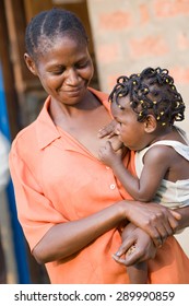 LUKONGA, DEMOCRATIC REPUBLIC OF CONGO - CIRCA, SEPTEMBER 2008.  UNICEF Mission Against Tetanus. Congolese Woman Breastfeed Her Daughter.