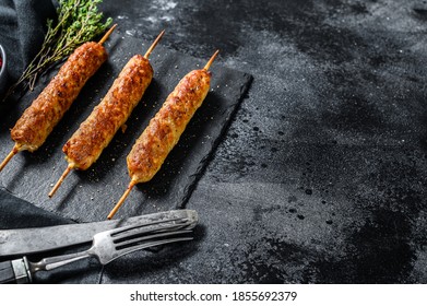 Lula Kebab. Shish Kebab On A Stick, From Ground Beef Meat. Black Background. Top View. Copy Space