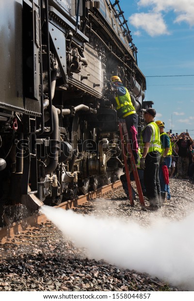 Luling, Texas - 6 November 2019:  maintenance being\
performed on the Union Pacific Big Boy steam engine 4014 during\
brief stop