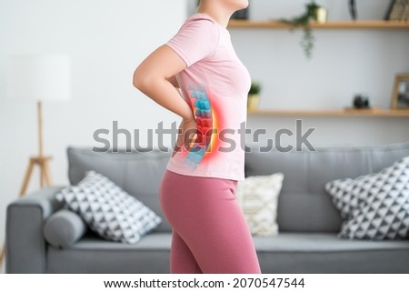 Lumbar intervertebral spine hernia, woman with back pain at home, spinal disc disease, health problems concept