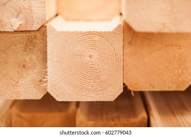 Lumber Industrial Wood Texture, Timber Butts Background. Butt End Of A Processed Wooden Beam. Many Elements