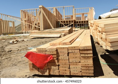 Lumber Stacked Up At New Home Construction Site.