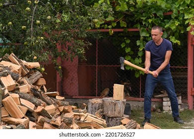 a lumberjack is chopping wood.  - Powered by Shutterstock