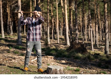 Lumberjack man chopping wood with ax in forest - Powered by Shutterstock