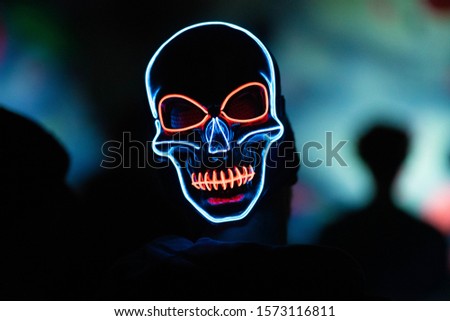 Luminating Light-up skull mask shot at a local night event