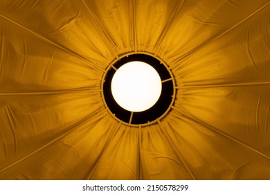 Luminous Bulb In Yellow Vintage Lampshade