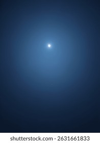 A luminous celestial body shining in a dark night sky
