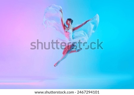 Luminous leap. Ballet dancer in white tutu jumping while dancing in motion in neon light against vivid gradient background. Concept of art, movement, classical and modern fusion, beauty, fashion. Ad