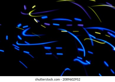 Luminous multicolored wavy lines on a black background