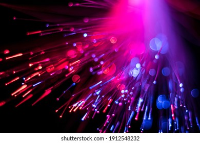 Luminous optical fiber, dots and lines. Selective focus. Abstract background.