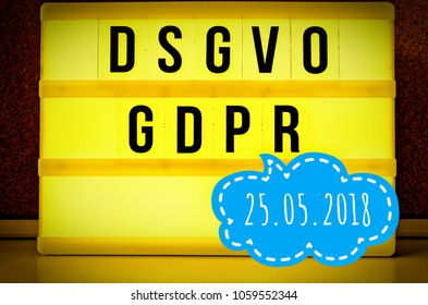 Luminous panel with the inscription DSGVO and GDPR (Datenschutzgrundverordnung) yellow in English GDPR (General Data Protection Regulation) and the inscription 25.05.2018 in English 05/25/2018