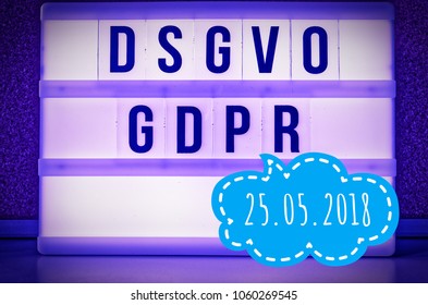 Luminous panel with the inscription DSGVO and GDPR (Datenschutzgrundverordnung) purple in English GDPR (General Data Protection Regulation) and the inscription 25.05.2018 in English: 05/25/2018