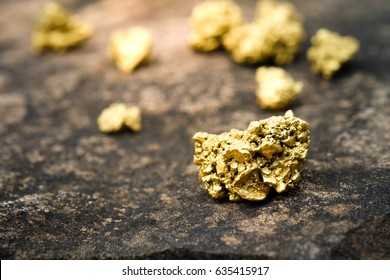 A lump of gold on a stone floor