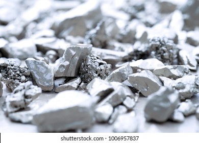 lump of silver or platinum on a stone floor