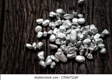 Lump Of Silver Or Platinum Ore On The Old Wooden Floor