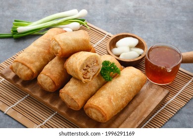 Lumpia or lunpia, traditional snacks from Semarang, Central Java, Indonesia. Traditional spring rolls contain stir-fried bamboo shoots (rebung), eggs, and chicken or shrimp. 
 - Shutterstock ID 1996291169
