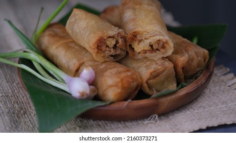 Lumpia Semarang On Wooden Plate With Spring Onion And Green Chilli. Indonesia Food.