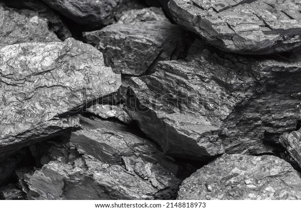 Lumps of black lignite or bituminous\
coal. Natural source of energy. Mineral stone\
rock