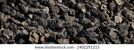 Lumps of coal with pyrite coating. Pyrite is called fool's gold.