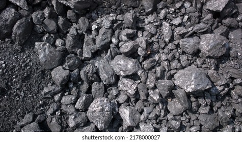 Lumps of coal of varying sizes in pile on ground, near Dali, Yunnan, China