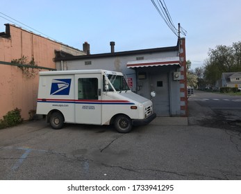 LUNA PIER, MICHIGAN / U.S.A. : MAY 17, 2020 : The Local Mail Delivery Truck Behind Luna Pier's Post Office After Hours.