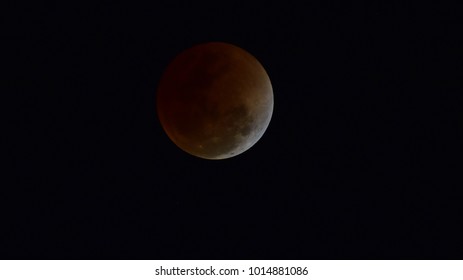 A lunar eclipse occurs when the Moon passes directly behind the Earth into its umbra (shadow). This can occur only when the sun, Earth and moon are aligned (in "syzygy") exactly or very closely.