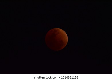 A lunar eclipse occurs when the Moon passes directly behind the Earth into its umbra (shadow). This can occur only when the sun, Earth and moon are aligned (in "syzygy") exactly or very closely.