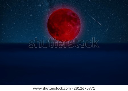 Lunar eclipse on a starry Milky Way background.
