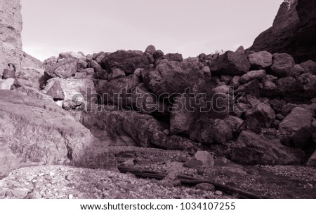 Similar – Beautiful young woman thinking and sitting on the rocks outdoors on the countryside