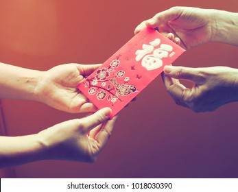Lunar New Year celebrations with red envelopes in hands. The 1st chinese sentence is how we chinese always wish people Happy Chinese New Year. The 2nd means all things going smooth and well.