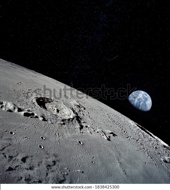 The lunar surface, taken from a corner, with the\
preserved footprints of the astronauts who have been there as\
evidence of the presence of a person. Elements of this image\
furnished by NASA.