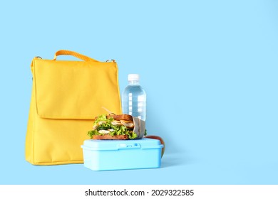 Lunch Box Bag, Bottle Of Water And Sandwich On Color Background