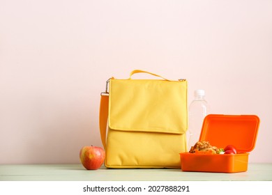 Lunch Box Bag And Food On Color Background