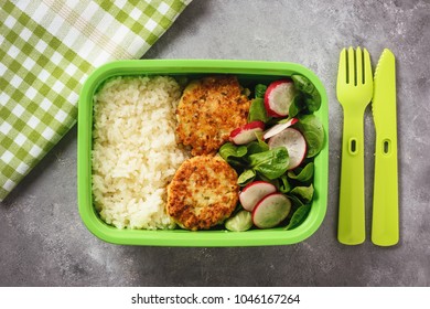 Lunch Box With Boiled Rice, Chicken Cutlets Ans Radush Salad.