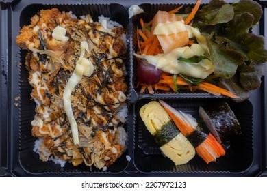 Lunch Box With Fried Chicken Rice, Salad And Sushi