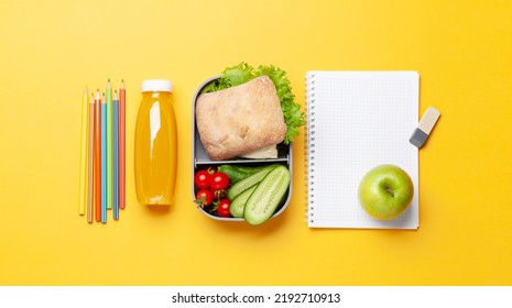 Lunch Box With Sandwich, Vegetables And Juice. School Or Office Meal And Supplies. Flat Lay With Copy Space