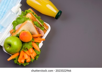 Lunch Box At School And Office On A Dark Background. Social Distance, Stay Safe. Hygiene And Protection Against Bacteria And Viruses. View From Above. Copy Space.