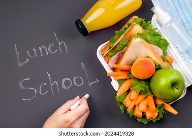 Lunch Box At School And Office On A Dark Background. Chalk Writing Lunch School. Social Distance, Stay Safe. Hygiene And Protection Against Bacteria And Viruses. View From Above. Copy Space