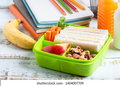 Lunch Box Set Of Ham Cheese Sandwich With Carrot And Mixed Nuts, Apple In Box, Banana And Orange Juice With Milk. Kid Bento Pack For School.